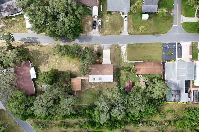 an aerial view of multiple houses with outdoor space