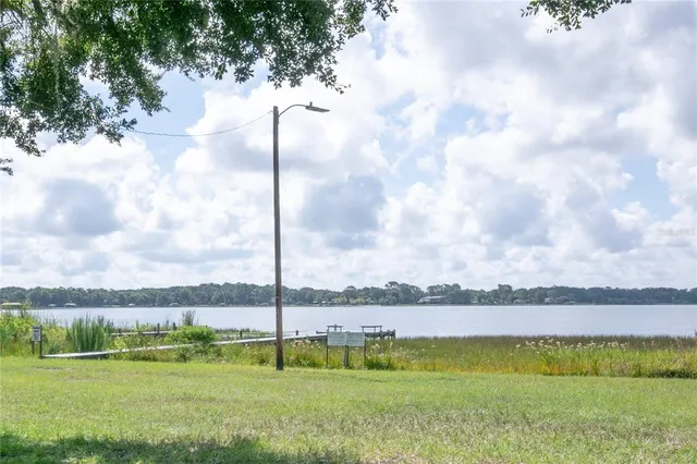a view of a lake with a big yard