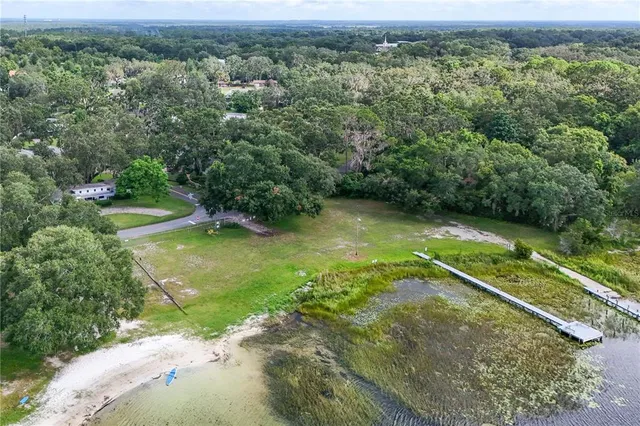 a view of a swimming pool with a yard