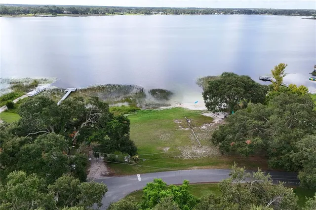 a view of a garden with a building in the background