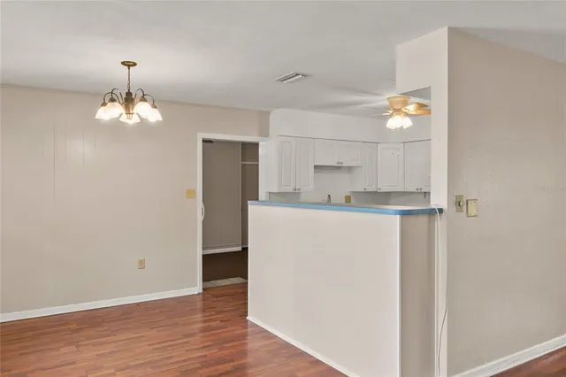a view of cabinets and wooden floor