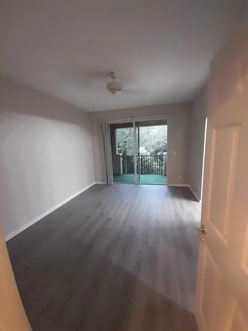 a bathroom with a shower sink and mirror