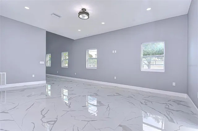 a view of an empty room with a window