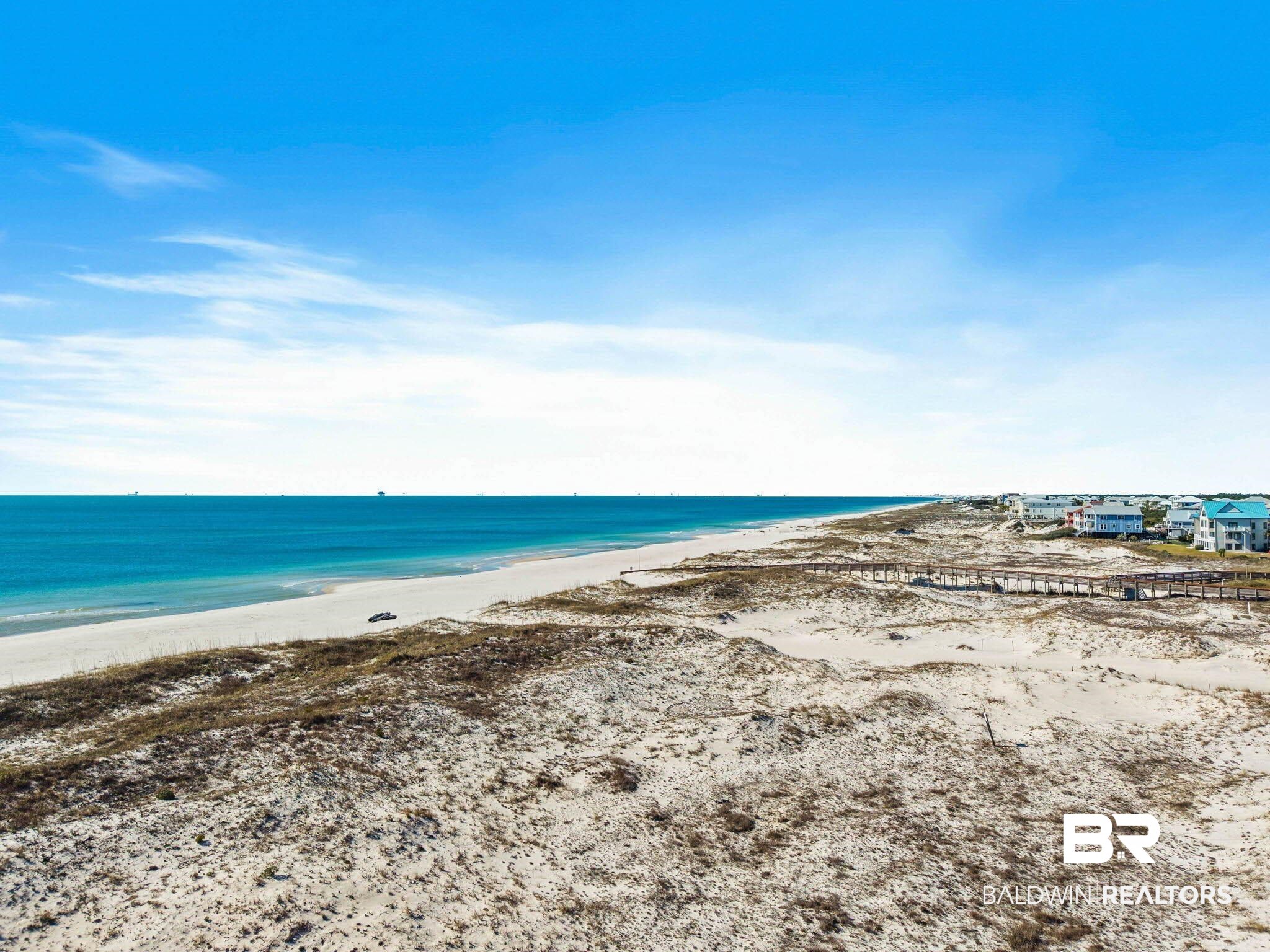 400 Plantation Road, Unit 4501 Gulf Shores, AL 36542 - Photo 26 of 30 Expansive sandy beach with turquoise waters and a distant shoreline