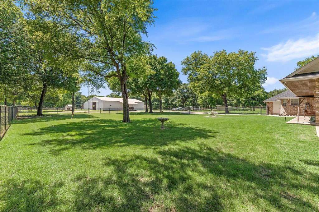 145 Indian Trail Decatur, TX 76234 - Photo 33 of 40 a view of a house with a backyard