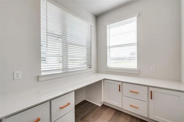 a room with cabinets and window