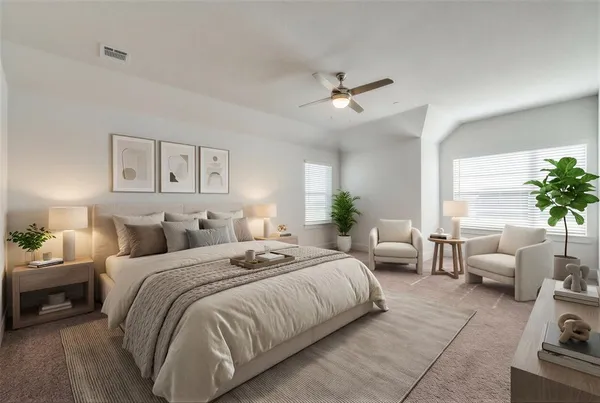 a spacious bedroom with a bed a couch and potted plant