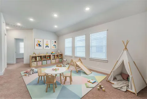 a living room with furniture a window and a dining table