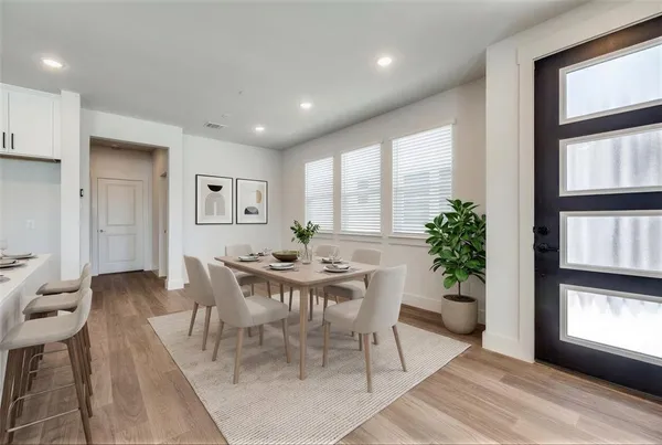 a view of a dining room with furniture and window