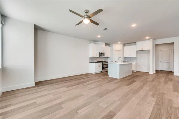 a view of kitchen with wooden floor