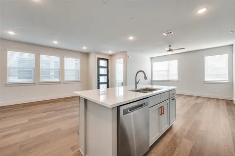 a kitchen with sink and window