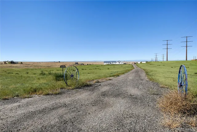 an aerial view of a house with a ocean view