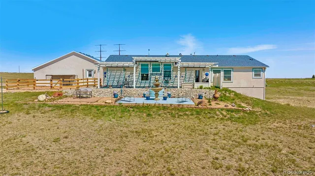 swimming pool view with a outdoor seating