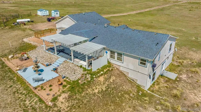 a living room with fireplace furniture and a chandelier
