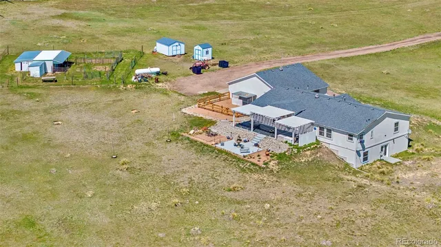 a kitchen with a table chairs stove and cabinets
