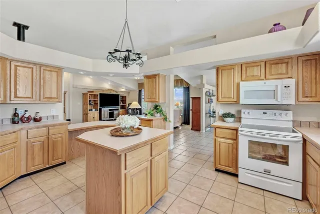 a bed room with a bed and a chandelier