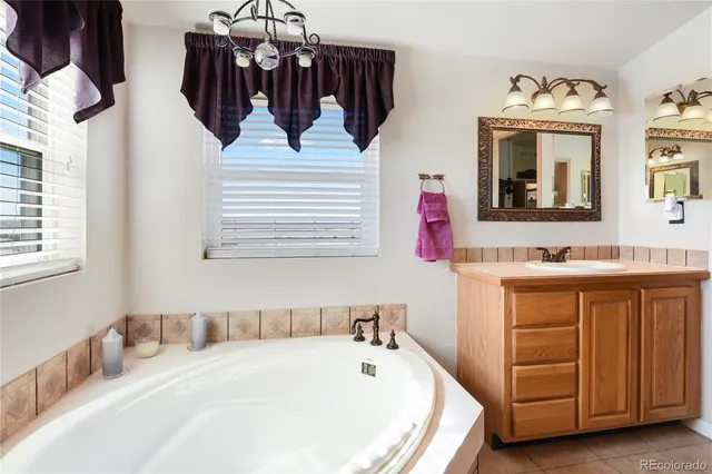 a front view of a house with garden and outdoor seating