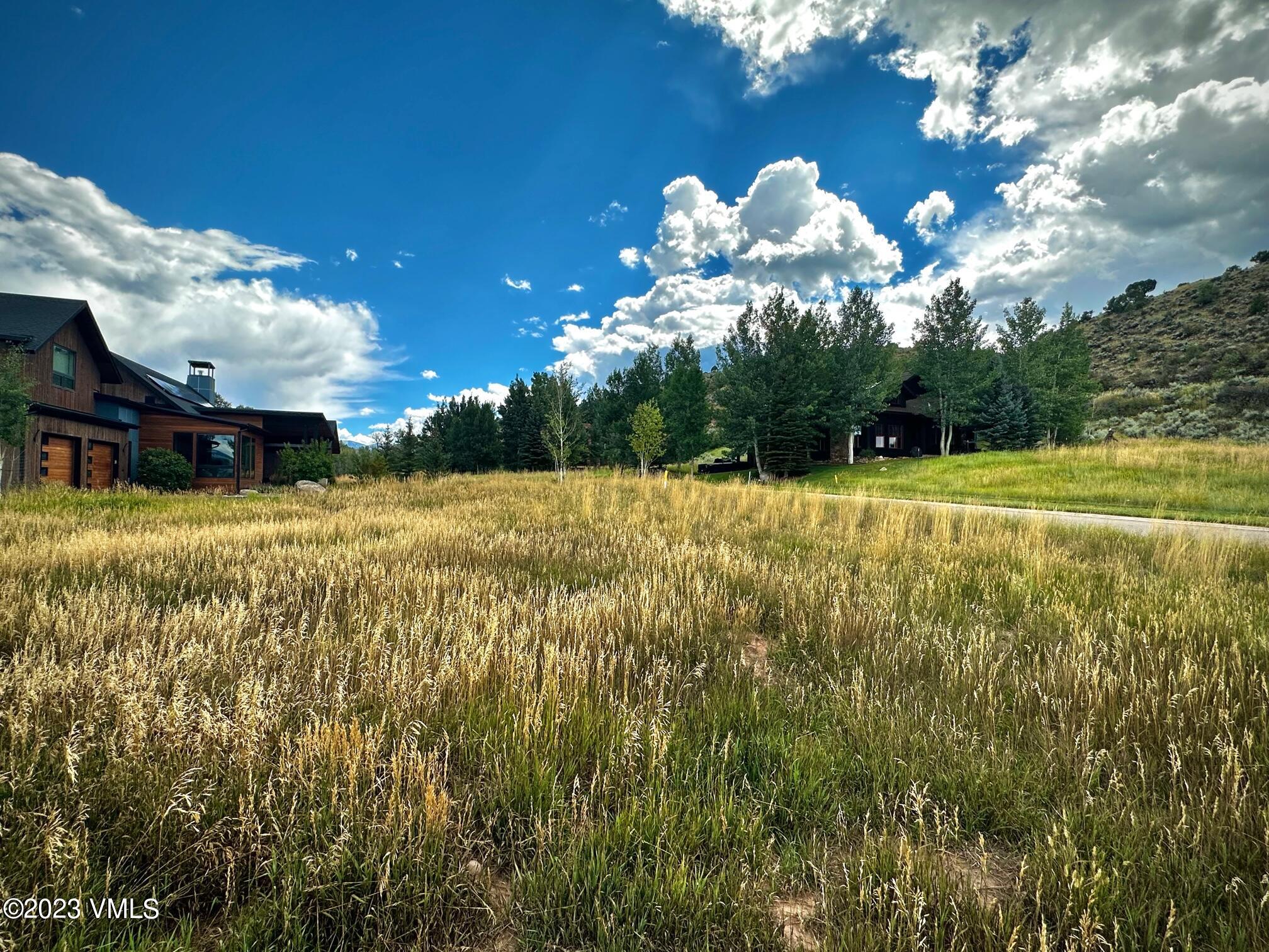 2547 Eagle Ranch Road Eagle, CO 81631 - Photo 2 of 5 a view of a golf course with a lake