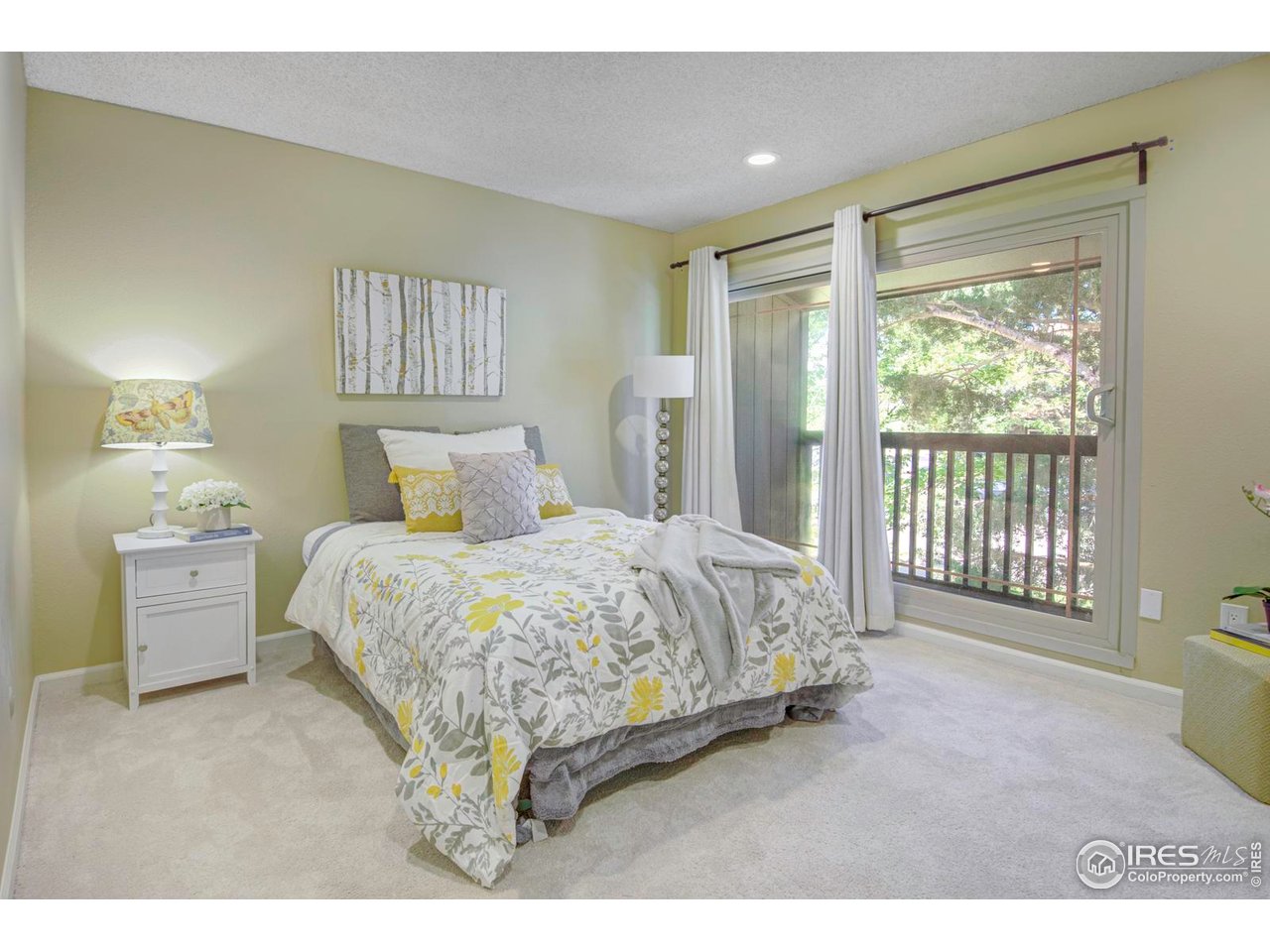 750 West Moorhead Circle, Unit A Boulder, CO 80305 - Photo 11 of 35 a spacious bedroom with a bed and a night stand