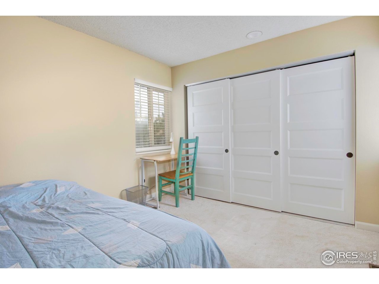 750 West Moorhead Circle, Unit A Boulder, CO 80305 - Photo 14 of 35 a bedroom with a bed and a table in it