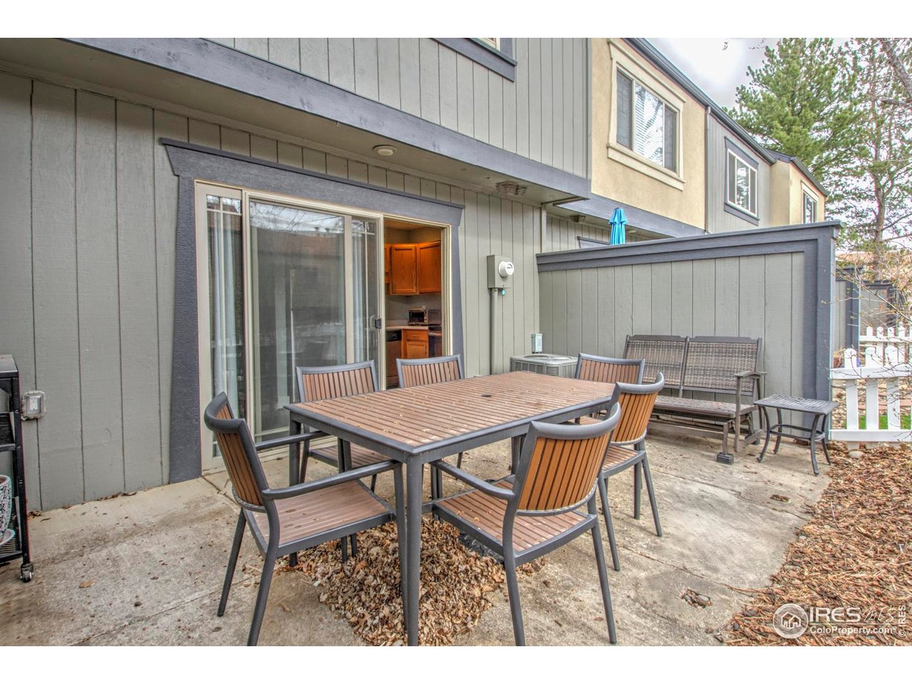 750 West Moorhead Circle, Unit A Boulder, CO 80305 - Photo 18 of 35 a backyard of a house with table and chairs