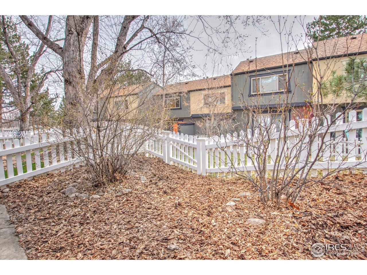 750 West Moorhead Circle, Unit A Boulder, CO 80305 - Photo 20 of 35 a backyard of a house with large trees