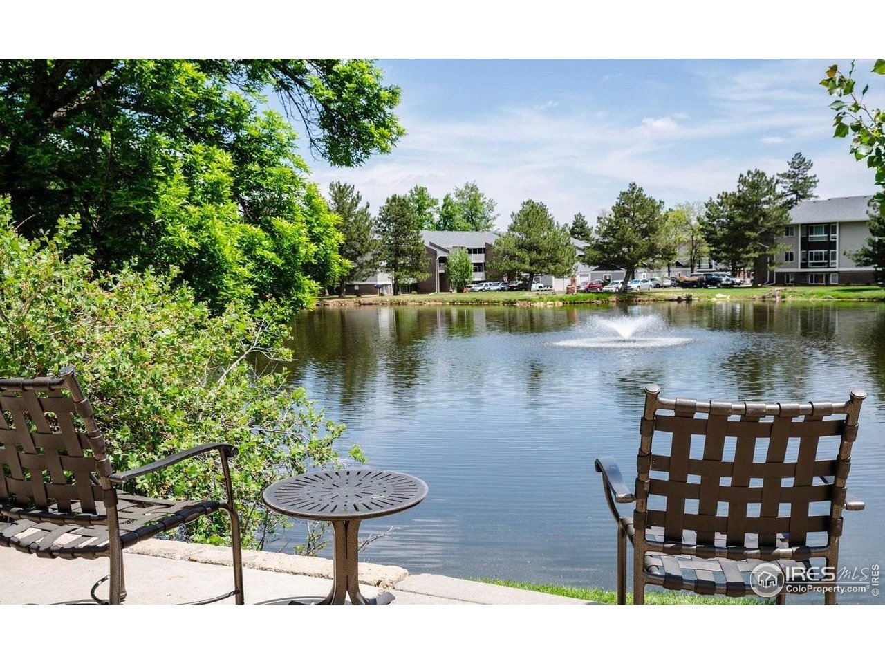 750 West Moorhead Circle, Unit A Boulder, CO 80305 - Photo 31 of 35 a view of a lake with a table and chairs