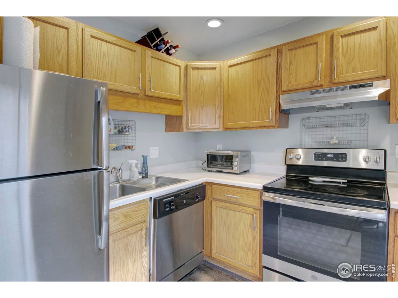 750 West Moorhead Circle, Unit A Boulder, CO 80305 - Photo 7 of 35 a kitchen with a refrigerator sink and cabinets
