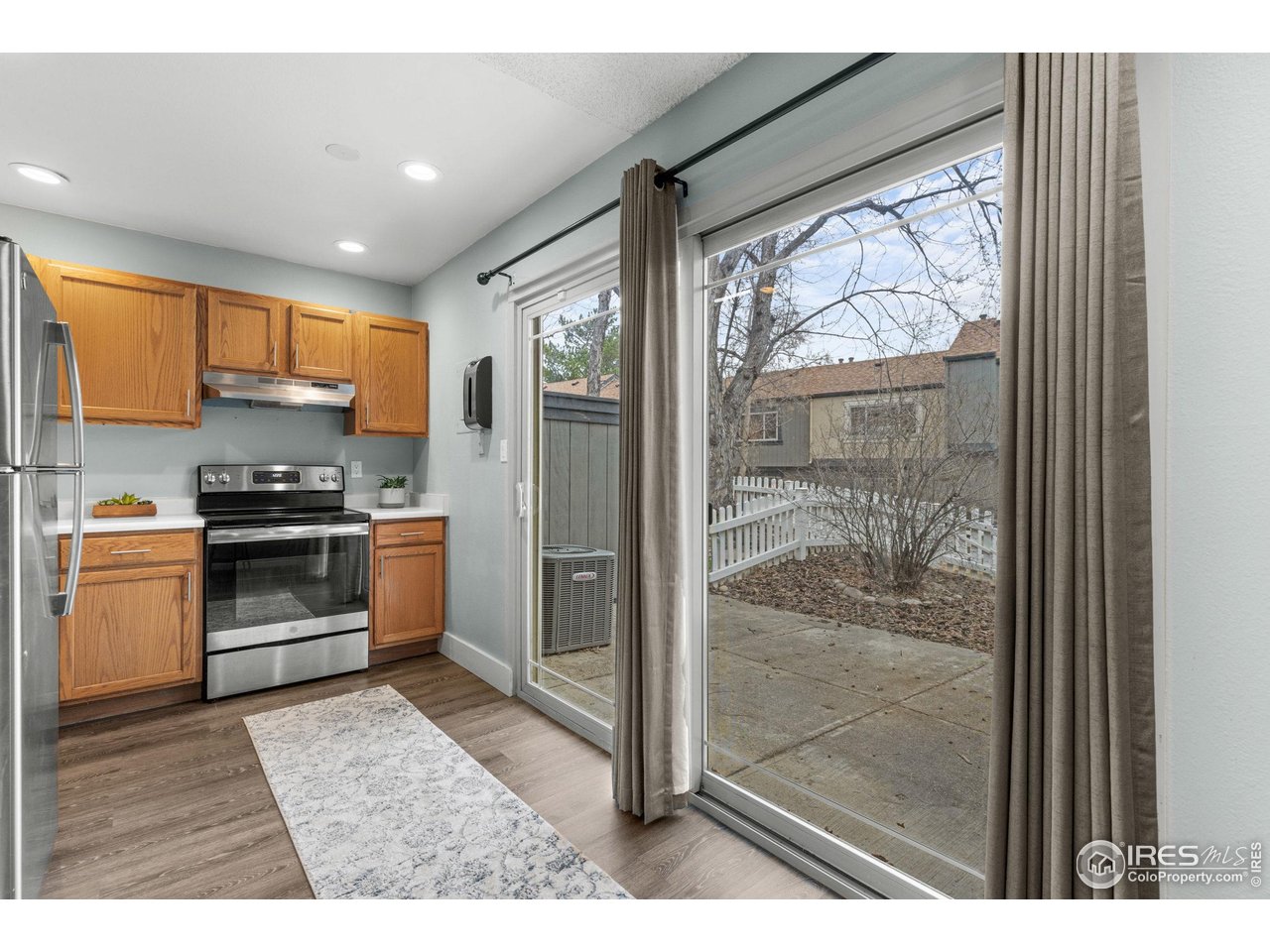 750 West Moorhead Circle, Unit A Boulder, CO 80305 - Photo 9 of 45 Kitchen with large patio door to your private outdoor space
