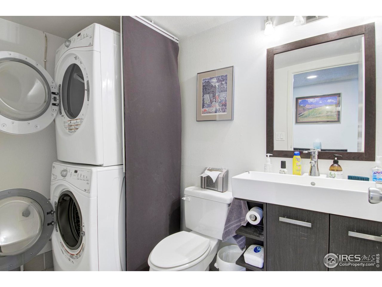 750 West Moorhead Circle, Unit A Boulder, CO 80305 - Photo 9 of 35 a bathroom with a sink a toilet and a mirror