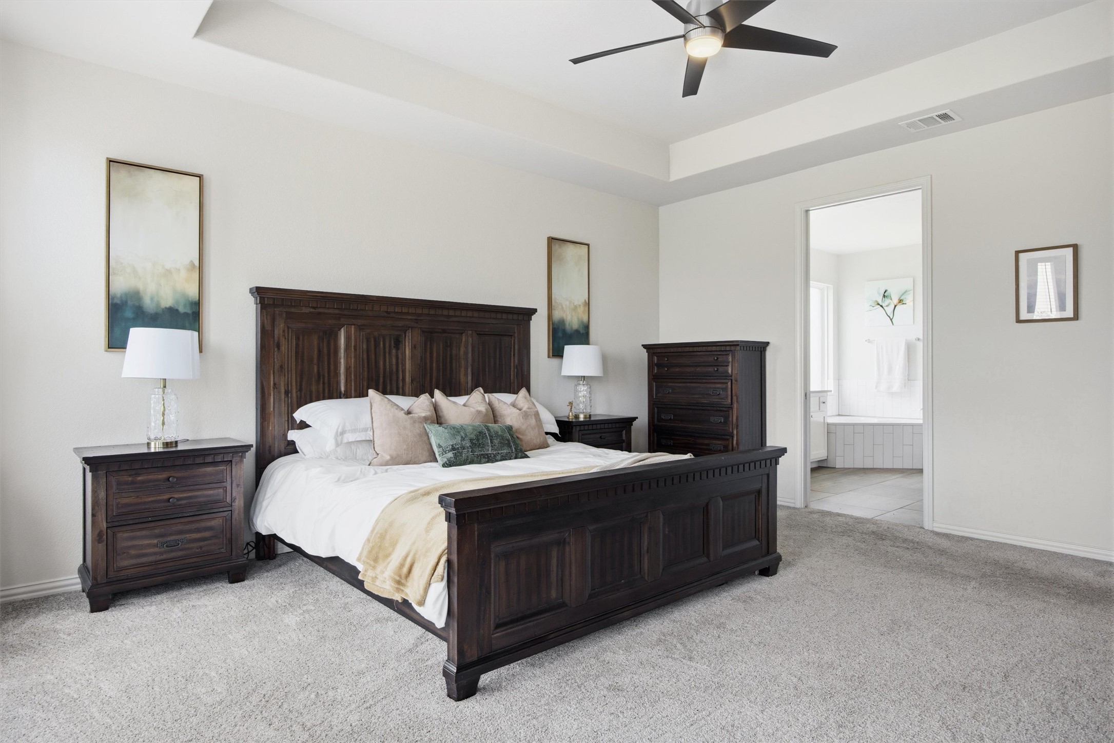 192 Raptor Beak Way Cedar Creek, TX 78612 - Photo 16 of 38 Tray ceiling with a ceiling fan overhead