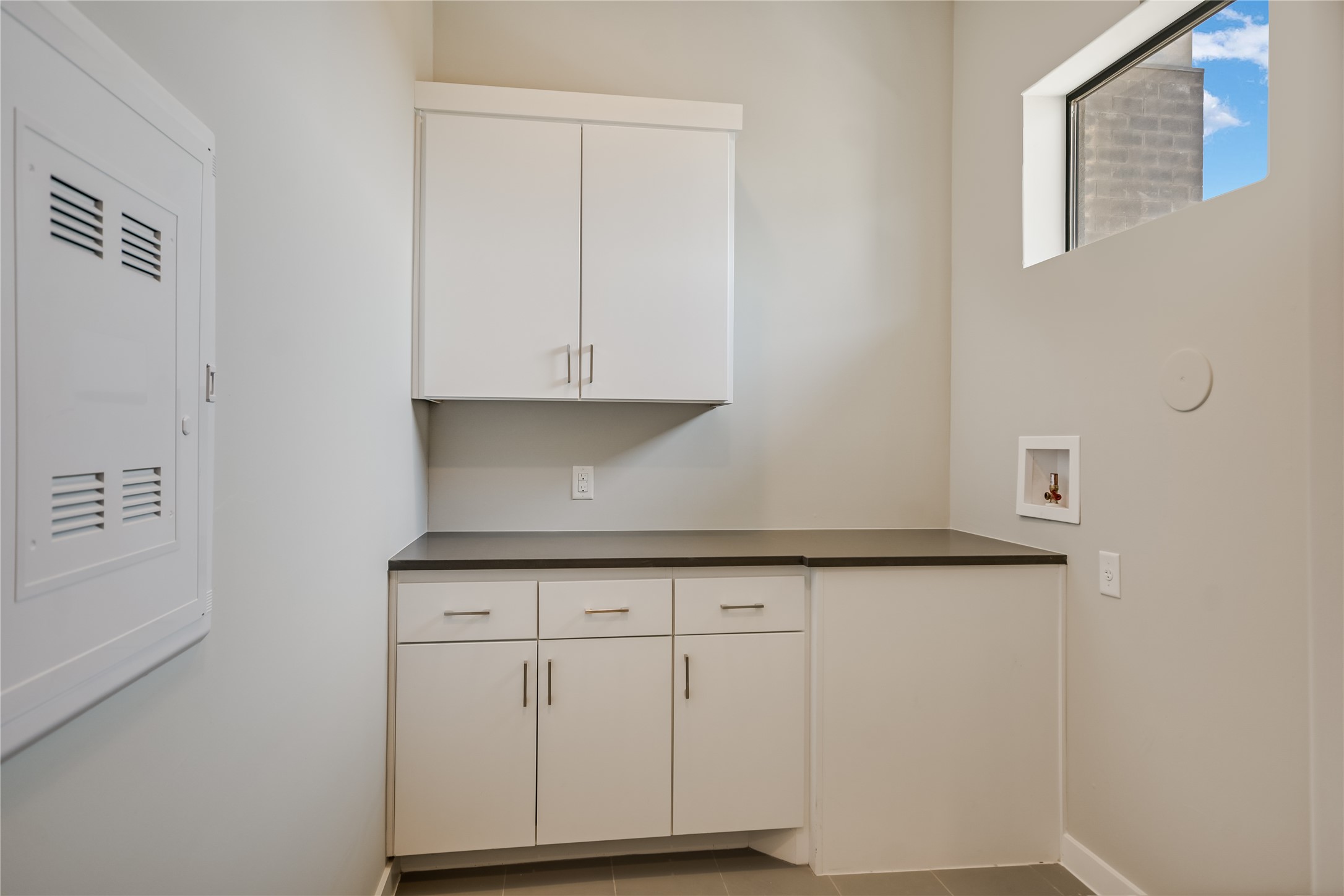 5921 Hiline Road, Unit 2403 Austin, TX 78734 - Photo 10 of 35 Generous storage and working counter in your natural light laundry room.