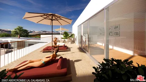 a sitting area with furniture and umbrella