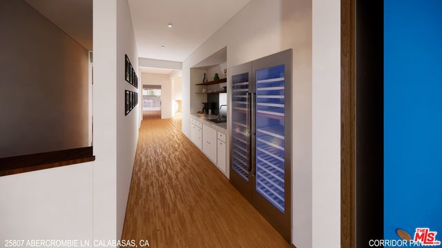 a view of a hallway with wooden floor and stairs