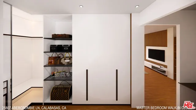 a view of kitchen with refrigerator and white cabinets