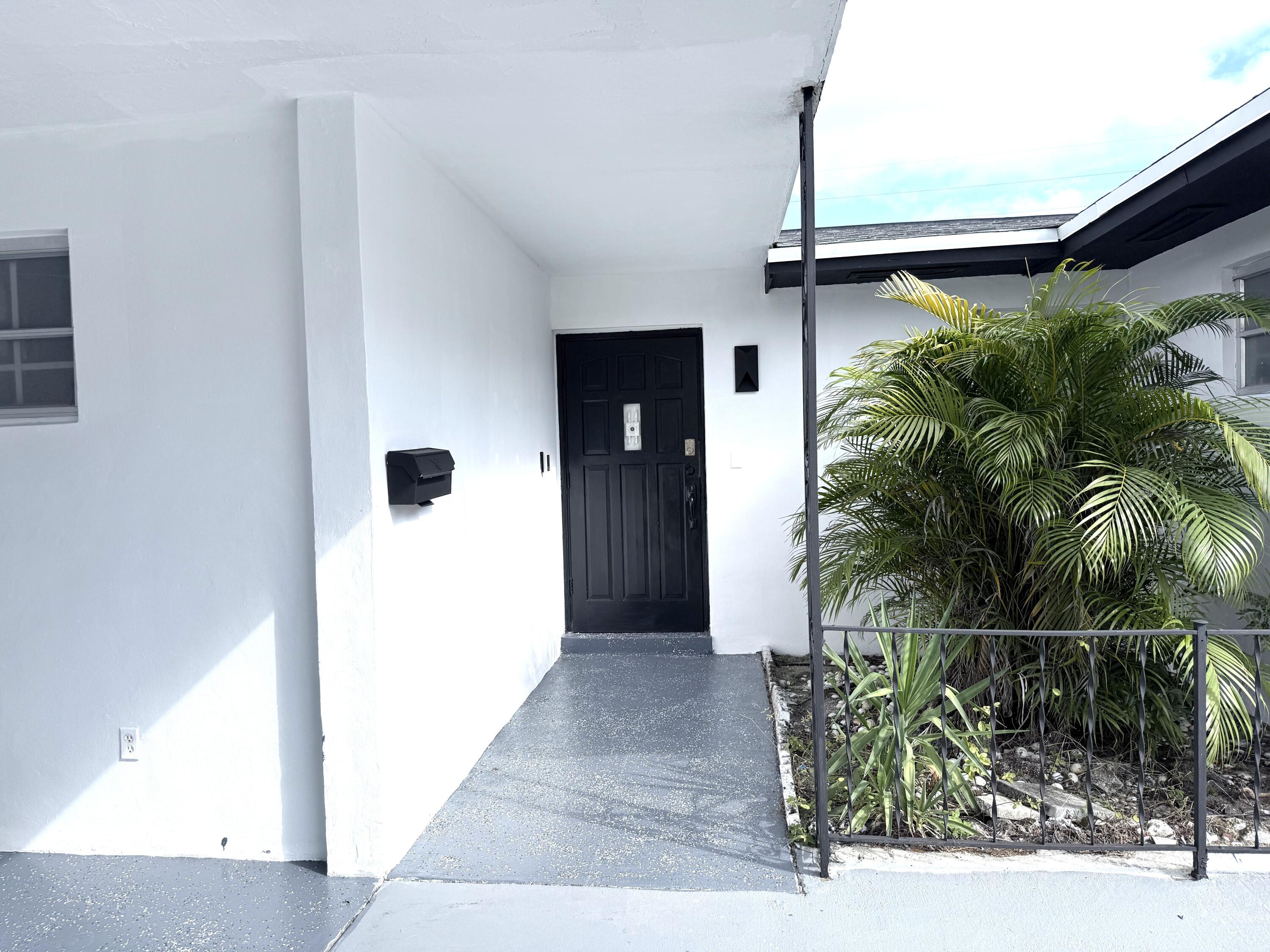 210 West 23rd Street Riviera Beach, FL 33404 - Photo 20 of 20 a view of a house with a backyard