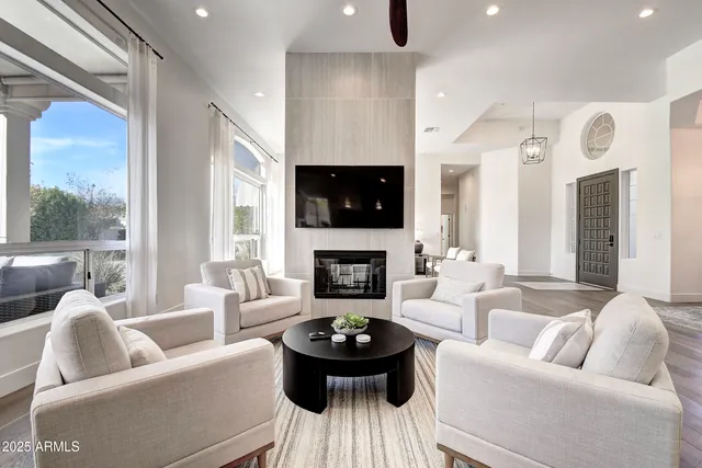 a kitchen with stainless steel appliances granite countertop a sink a stove and a wooden cabinets