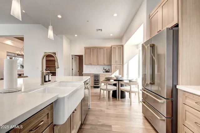 a spacious bathroom with a granite countertop sink mirror and a toilet