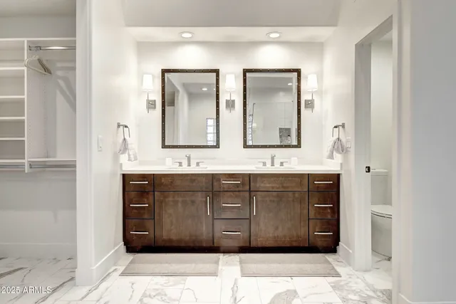 a bedroom with a bed and a night stand