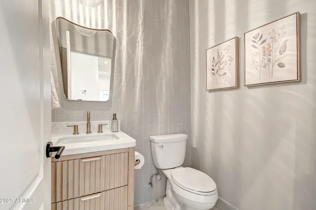 a table and chairs in patio of a house