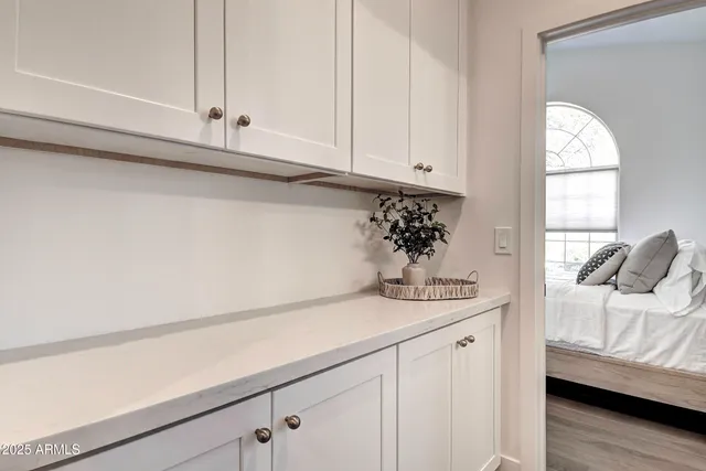 a front view of a house with plants