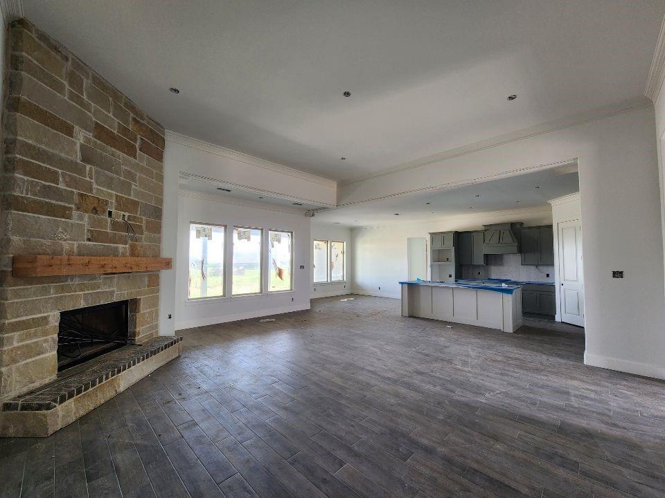 2408 Quartz Street Krum, TX 76249 - Photo 4 of 13 a view of living room with furniture and fireplace
