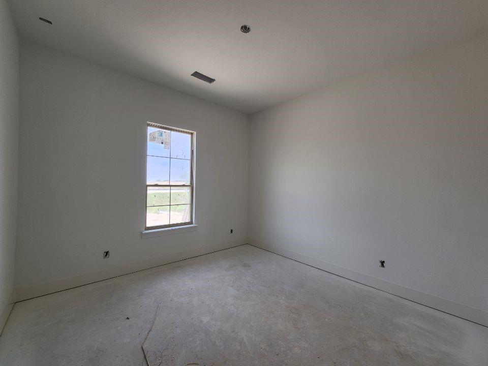 2408 Quartz Street Krum, TX 76249 - Photo 5 of 13 an empty room with a window