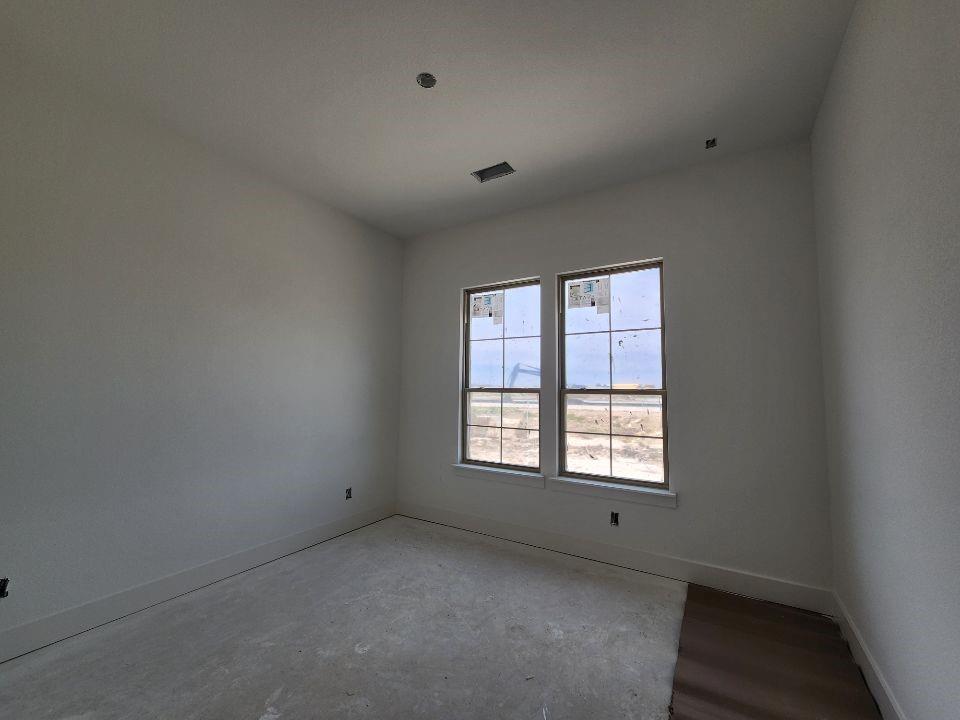 2408 Quartz Street Krum, TX 76249 - Photo 6 of 13 a view of an empty room with a window