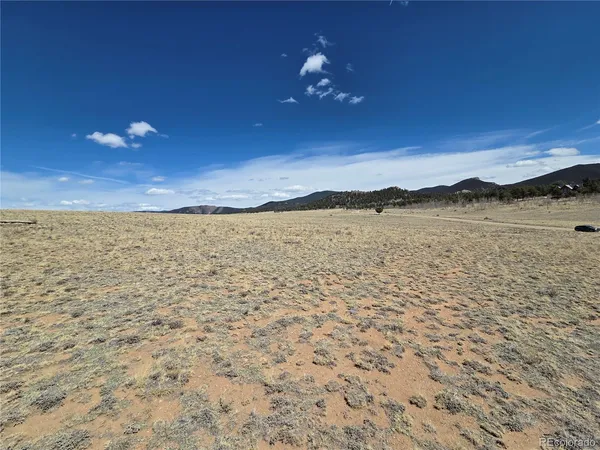 a view of an ocean beach and mountain