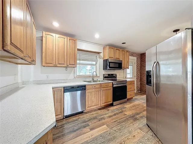 a bathroom with a sink a toilet and curtain