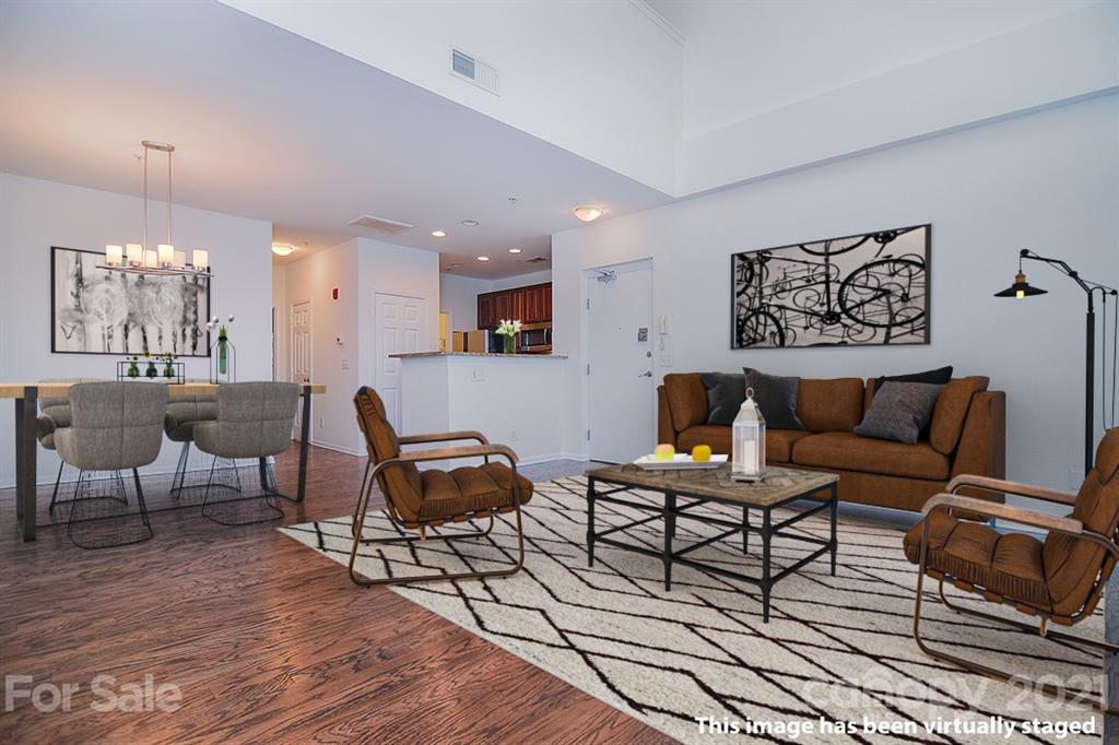 610 Raphael Place Charlotte, NC 28205 - Photo 2 of 27 a living room with furniture and a wooden floor