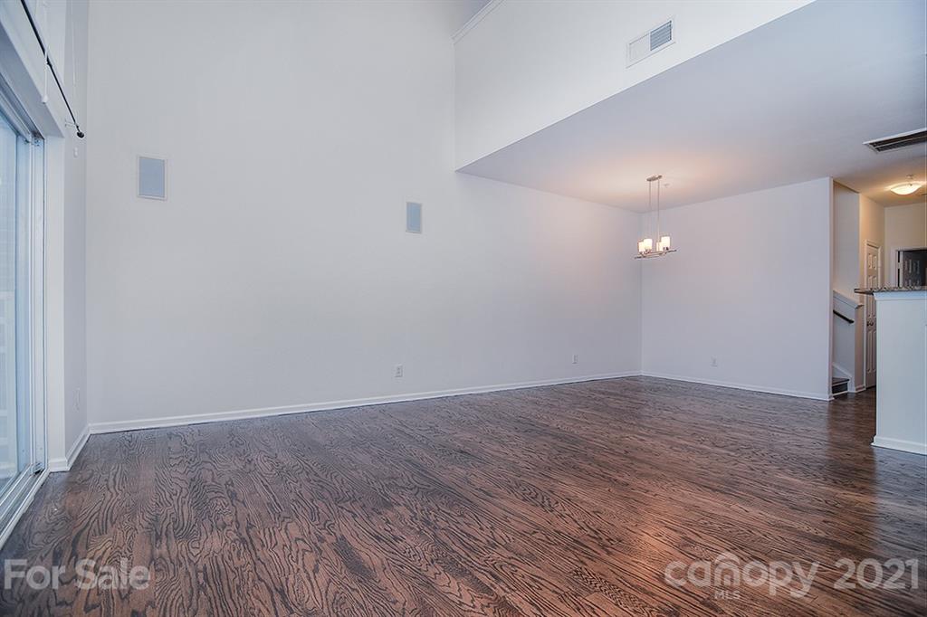 610 Raphael Place Charlotte, NC 28205 - Photo 11 of 27 a view of an empty room with wooden floor