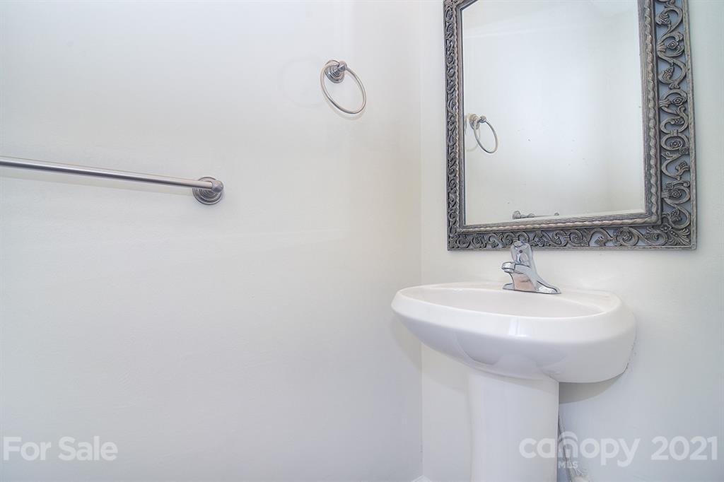 610 Raphael Place Charlotte, NC 28205 - Photo 15 of 27 a bathroom with a sink a mirror and a shower