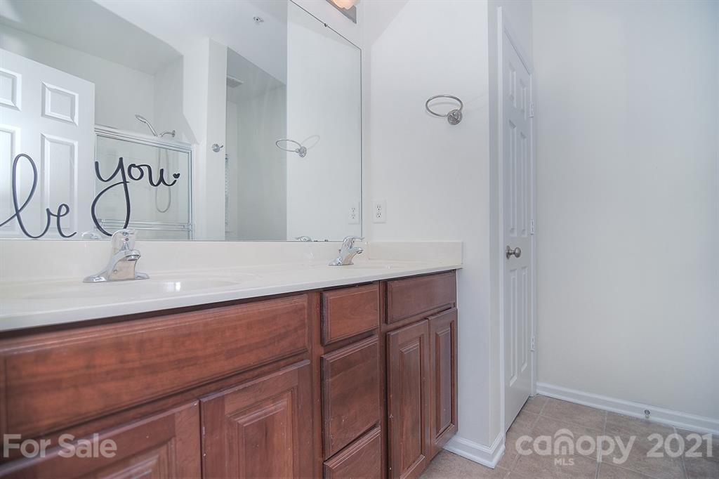 610 Raphael Place Charlotte, NC 28205 - Photo 18 of 27 a bathroom with a sink and a mirror